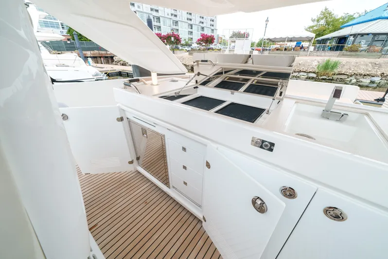  Yacht Photos Pics 2024 Jeanneau DB/43 OB boat with outdoor kitchen and sleek design.