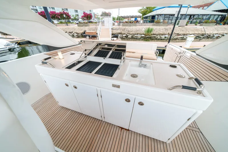  Yacht Photos Pics 2024 Jeanneau DB/43 OB yacht with outdoor kitchen and grill on deck.