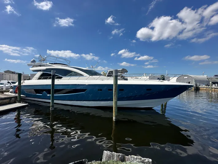  Yacht Photos Pics 2014 Cheoy Lee Alpha 87 Express Sportbridge yacht docked under a clear blue sky.