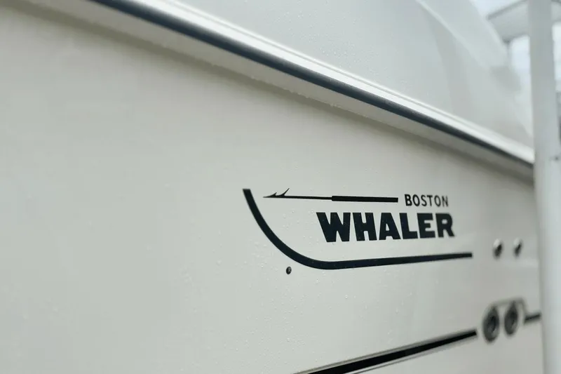  Yacht Photos Pics 2015 Boston Whaler 280 Outrage boat logo on white hull.