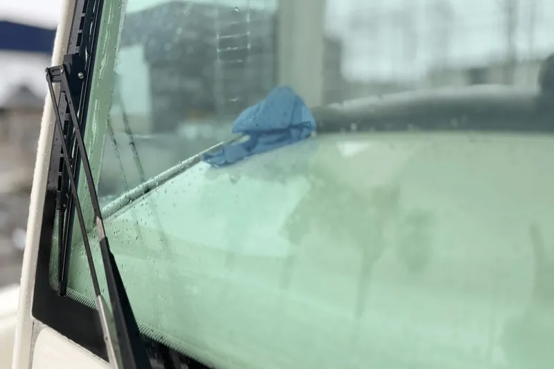  Yacht Photos Pics Close-up of 2015 Boston Whaler 280 Outrage windshield with raindrops and wiper.