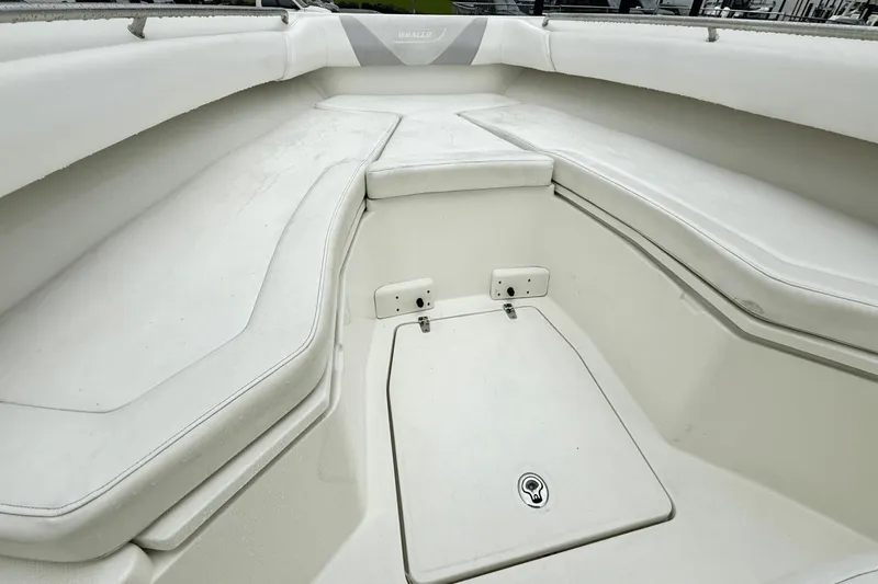  Yacht Photos Pics 2015 Boston Whaler 280 Outrage boat interior with white cushioned seating.