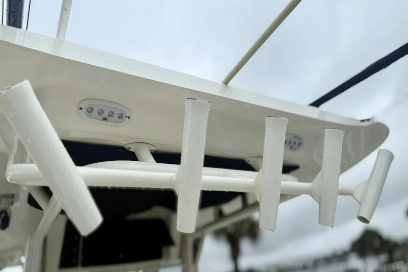  Yacht Photos Pics Boston Whaler 280 Outrage 2015 boat rod holders and lights on a cloudy day.