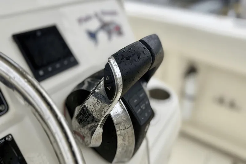  Yacht Photos Pics Close-up of 2015 Boston Whaler 280 Outrage boat controls with raindrops.