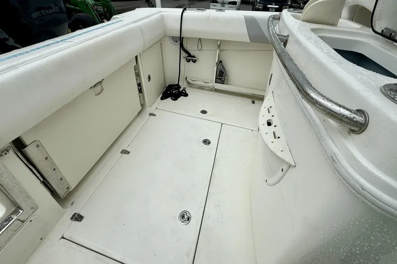  Yacht Photos Pics 2015 Boston Whaler 280 Outrage boat interior with storage compartments and seating.