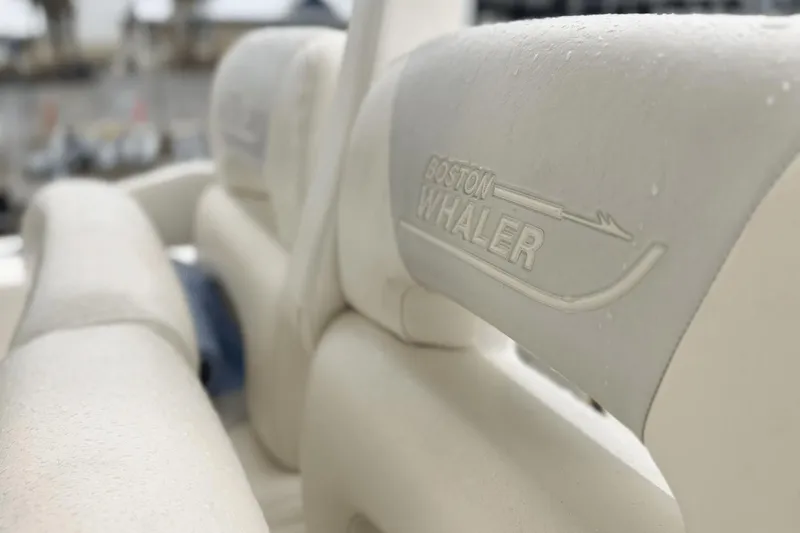  Yacht Photos Pics Close-up of 2015 Boston Whaler 280 Outrage seat with logo and water droplets.