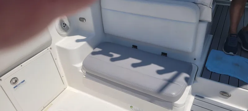 Dos Suenos Yacht Photos Pics Century 30 boat interior, 2015 model, featuring cushioned seating and deck details.