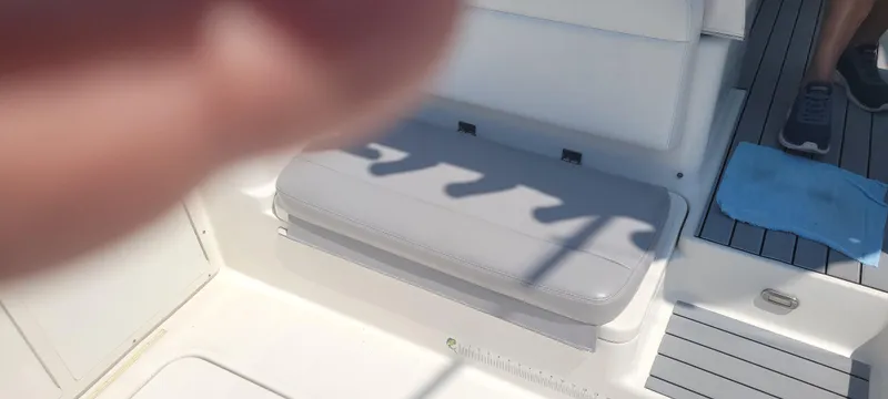 Dos Suenos Yacht Photos Pics Interior of a 2015 Century 30 boat, featuring seating and deck details.