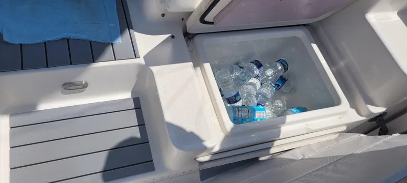Dos Suenos Yacht Photos Pics Cooler with bottled water and ice on a 2015 Century 30 boat deck.