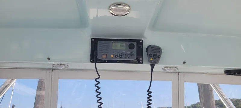 Dos Suenos Yacht Photos Pics Boat interior with radio system, Century 30, 2015 model, featuring a microphone and control panel.