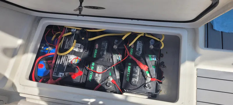 Dos Suenos Yacht Photos Pics Battery compartment of a 2015 Century 30 boat with multiple connected batteries.