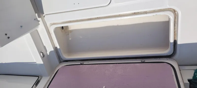 Dos Suenos Yacht Photos Pics Storage compartment on a 2015 Century 30 boat, open and empty.