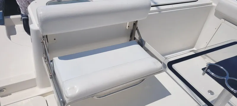 Dos Suenos Yacht Photos Pics White seating on a 2015 Century 30 boat, featuring sleek design and modern fixtures.