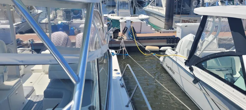 Dos Suenos Yacht Photos Pics Boats docked at a marina, featuring a 2015 Century 30 model.