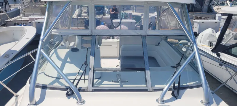 Dos Suenos Yacht Photos Pics Century 30 boat, 2015 model, docked with clear windows and sleek design.