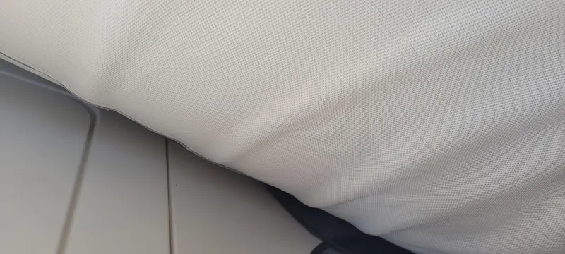 Dos Suenos Yacht Photos Pics White cushioned seat on a 2015 Century 30 boat.