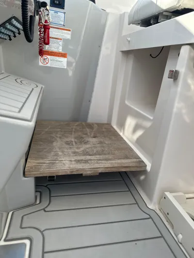  Yacht Photos Pics 2020 Regal 33 SAV interior with wooden step and safety instructions.