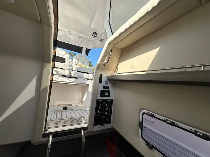  Yacht Photos Pics Interior view of 2020 Regal 33 SAV boat, showcasing cabin and seating area.