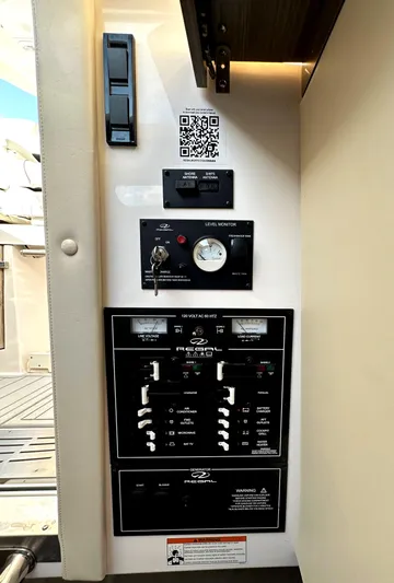  Yacht Photos Pics Control panel of a 2020 Regal 33 SAV boat with switches and gauges.