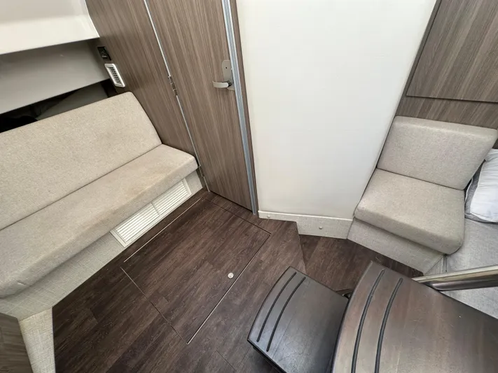  Yacht Photos Pics 2020 Regal 33 SAV interior with modern seating and wood flooring.