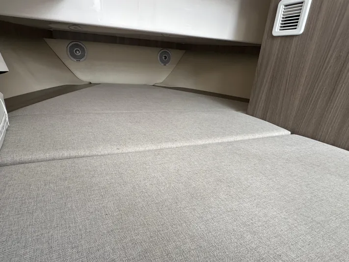  Yacht Photos Pics 2020 Regal 33 SAV cabin interior with beige upholstery and modern design.