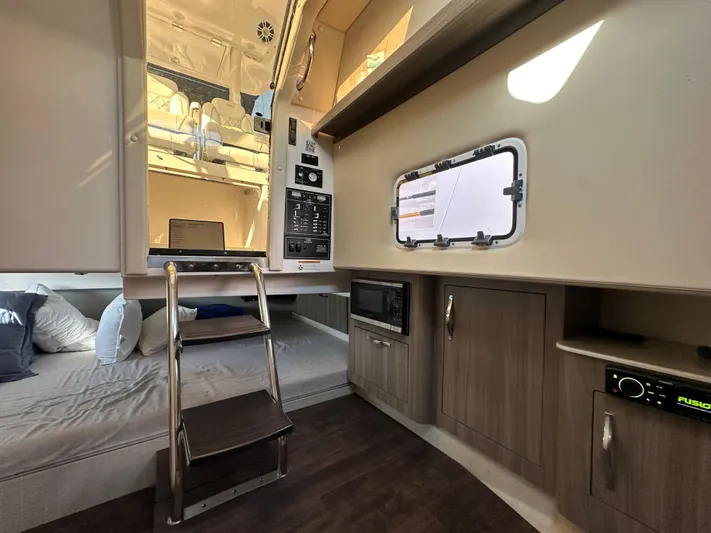  Yacht Photos Pics Interior of 2020 Regal 33 SAV boat with cozy seating and modern amenities.