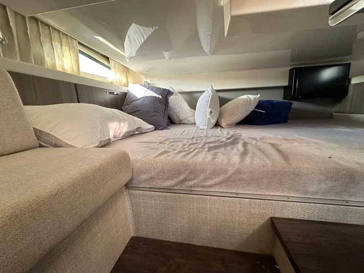  Yacht Photos Pics Cozy cabin interior of 2020 Regal 33 SAV with plush bedding and modern decor.