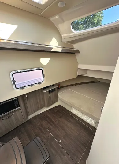  Yacht Photos Pics 2020 Regal 33 SAV cabin interior with modern design and natural light.