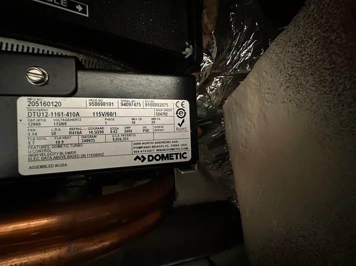  Yacht Photos Pics Label on Dometic appliance inside 2020 Regal 33 SAV boat, showing specifications and serial numbers.