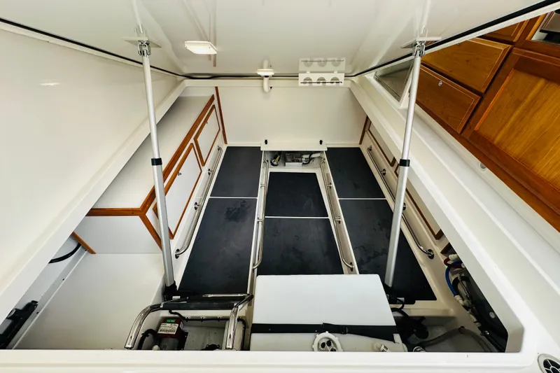 Amanda Yacht Photos Pics 2024 Back Cove 34O engine compartment with organized storage and sleek design.