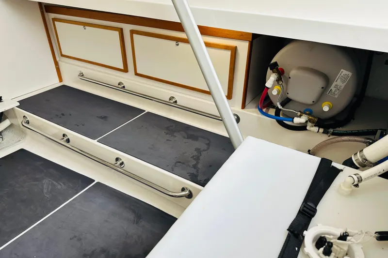 Amanda Yacht Photos Pics 2024 Back Cove 34O interior with storage compartments and plumbing system.