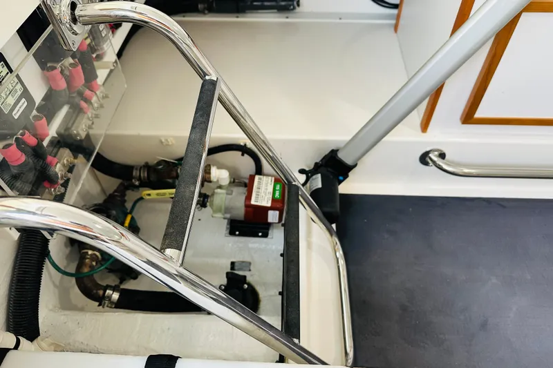 Amanda Yacht Photos Pics Engine compartment of 2024 Back Cove 34O boat, showcasing mechanical components and wiring.