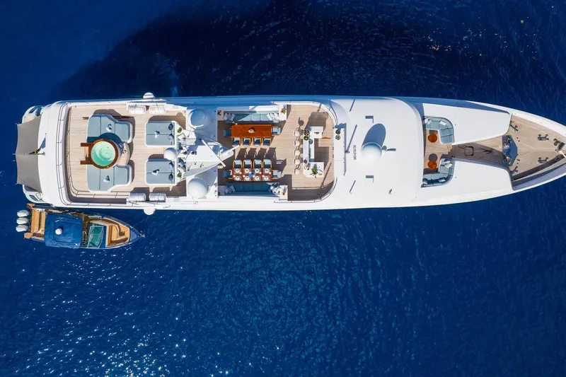 Oceanos Yacht Photos Pics Aerial view of 2006 Mondomarine motor yacht on deep blue sea.