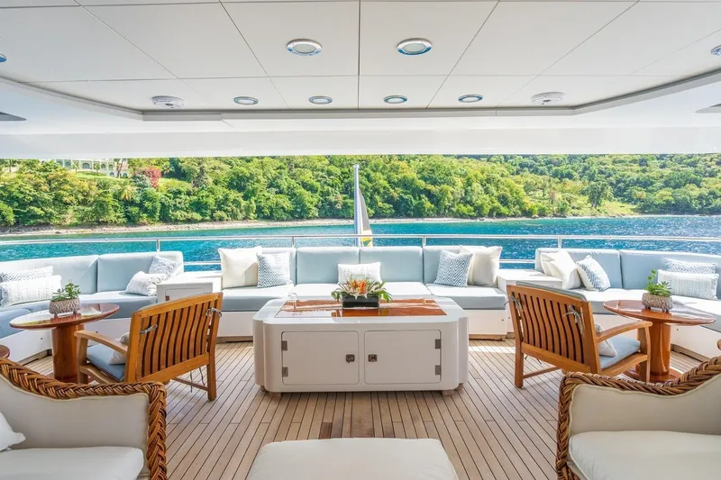 Oceanos Yacht Photos Pics Luxurious 2006 Mondomarine motor yacht deck with elegant seating and scenic ocean view.