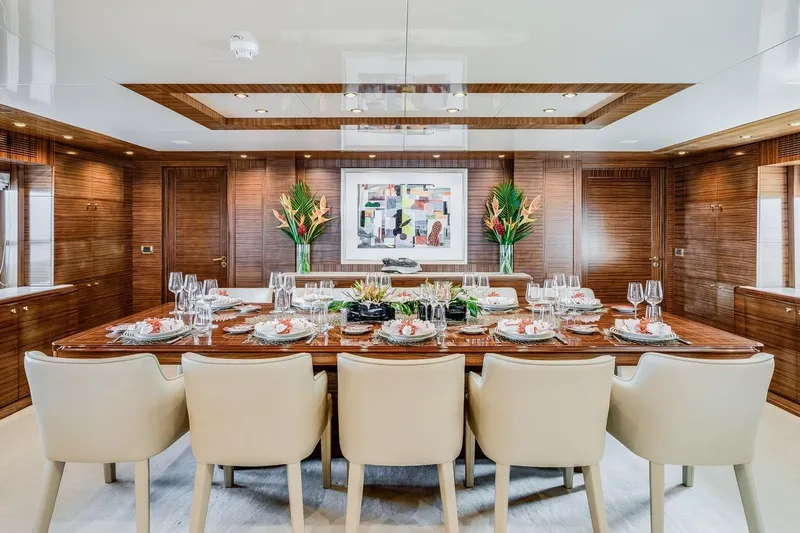 Oceanos Yacht Photos Pics Luxurious dining area on a 2006 Mondomarine motor yacht, featuring elegant table settings.