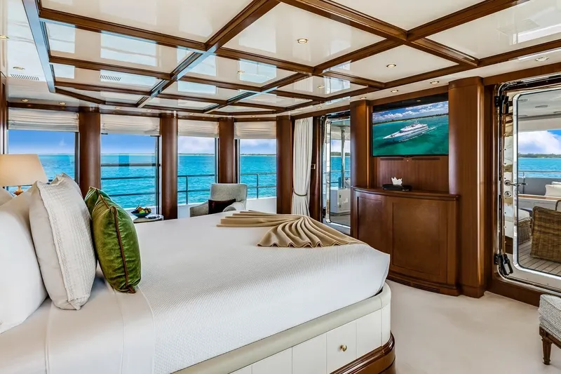 Oceanos Yacht Photos Pics Luxurious Mondomarine motor yacht bedroom with ocean view, elegant decor, and modern amenities, 2006 model.