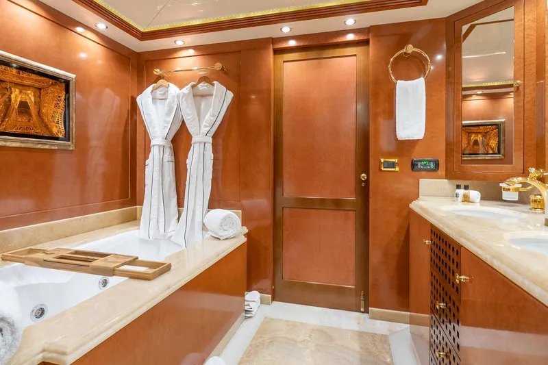 Oceanos Yacht Photos Pics Luxurious Mondomarine motor yacht bathroom, 2006 model, featuring elegant wood finishes and plush amenities.