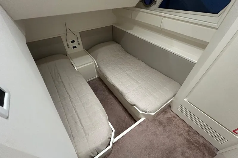  Yacht Photos Pics Interior cabin of 2020 Itama 62 yacht with twin beds and modern design.