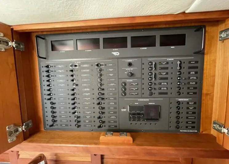 Better By Far Yacht Photos Pics Control panel inside a 2012 Hinckley Talaria boat, featuring various switches and indicators.