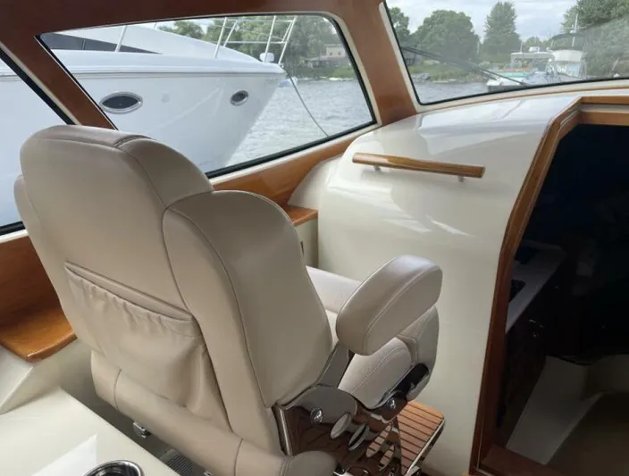 Better By Far Yacht Photos Pics Interior of a 2012 Hinckley Talaria yacht with beige leather seating.