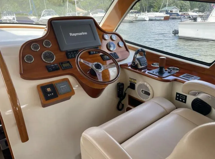 Better By Far Yacht Photos Pics Helm of 2012 Hinckley Talaria boat with Raymarine navigation system and luxurious seating.