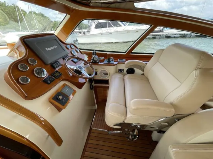 Better By Far Yacht Photos Pics Luxurious 2012 Hinckley Talaria yacht helm with leather seating and advanced navigation controls.