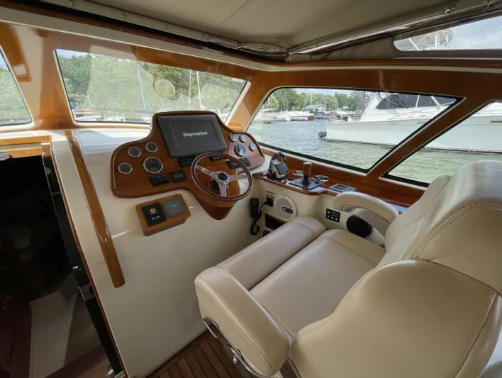 Better By Far Yacht Photos Pics Helm of 2012 Hinckley Talaria boat with leather seating and navigation controls.
