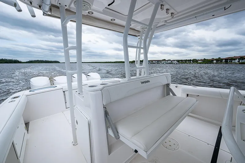 Riptide Yacht Photos Pics 2018 Everglades 435 Center Console boat on water, showcasing spacious seating and sleek design.