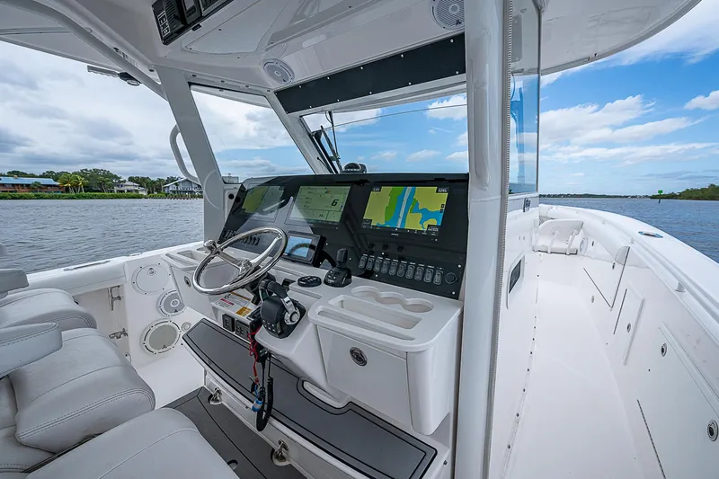 Riptide Yacht Photos Pics 2018 Everglades 435 Center Console boat interior with advanced navigation system and luxurious seating.