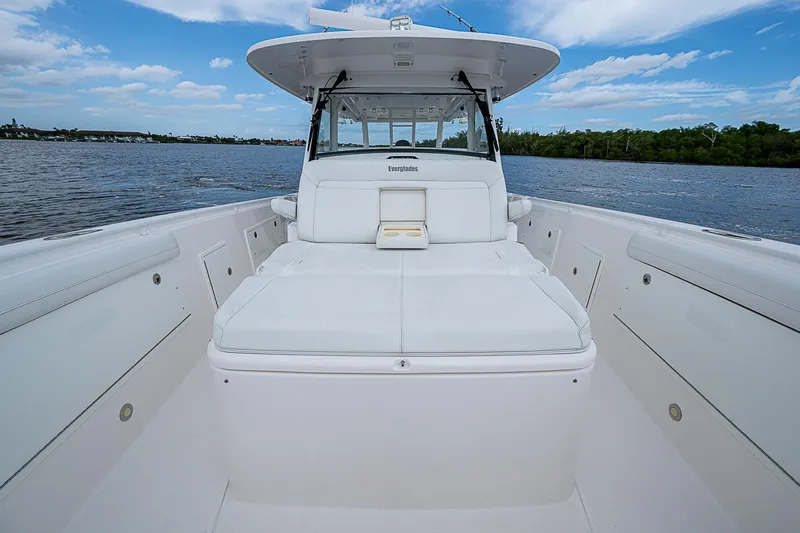 Riptide Yacht Photos Pics 2018 Everglades 435 Center Console boat on calm water under blue sky.