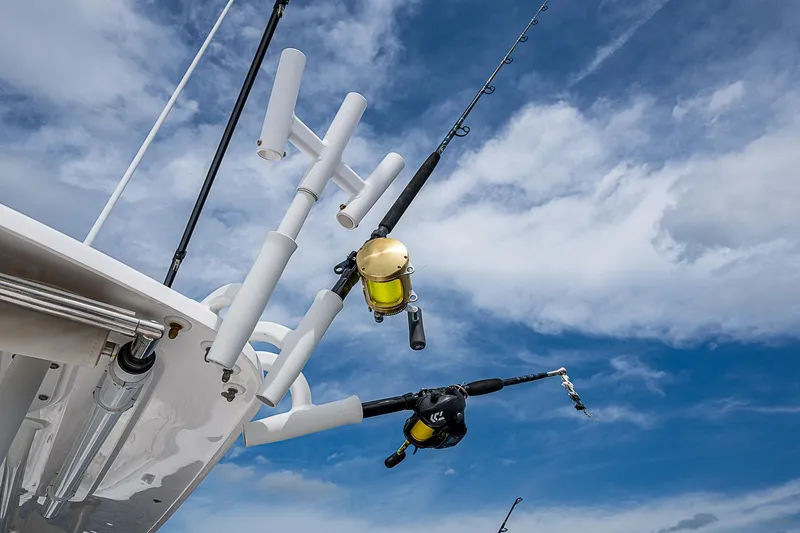 Riptide Yacht Photos Pics Fishing rods on a 2018 Everglades 435 Center Console against a blue sky.