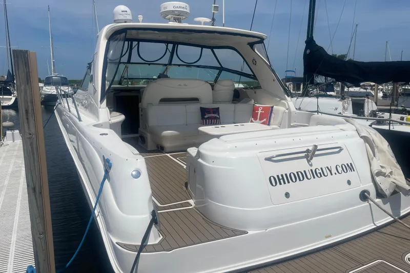  Yacht Photos Pics 2001 Sea Ray 460 Sundancer yacht docked, featuring spacious seating and custom website branding.