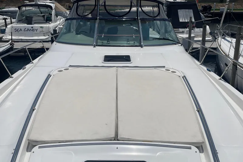  Yacht Photos Pics 2001 Sea Ray 460 Sundancer yacht with sunpad, docked at marina.