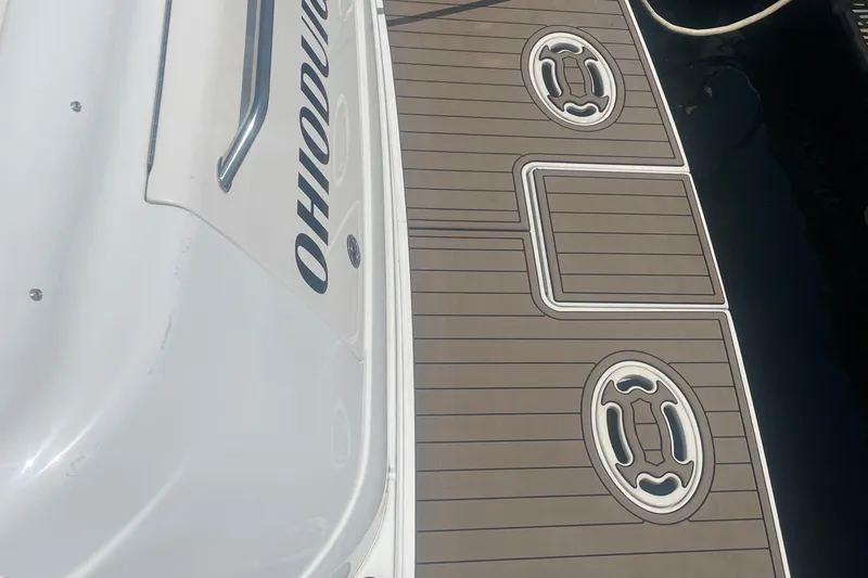  Yacht Photos Pics 2001 Sea Ray 460 Sundancer boat deck with custom flooring and visible railing.